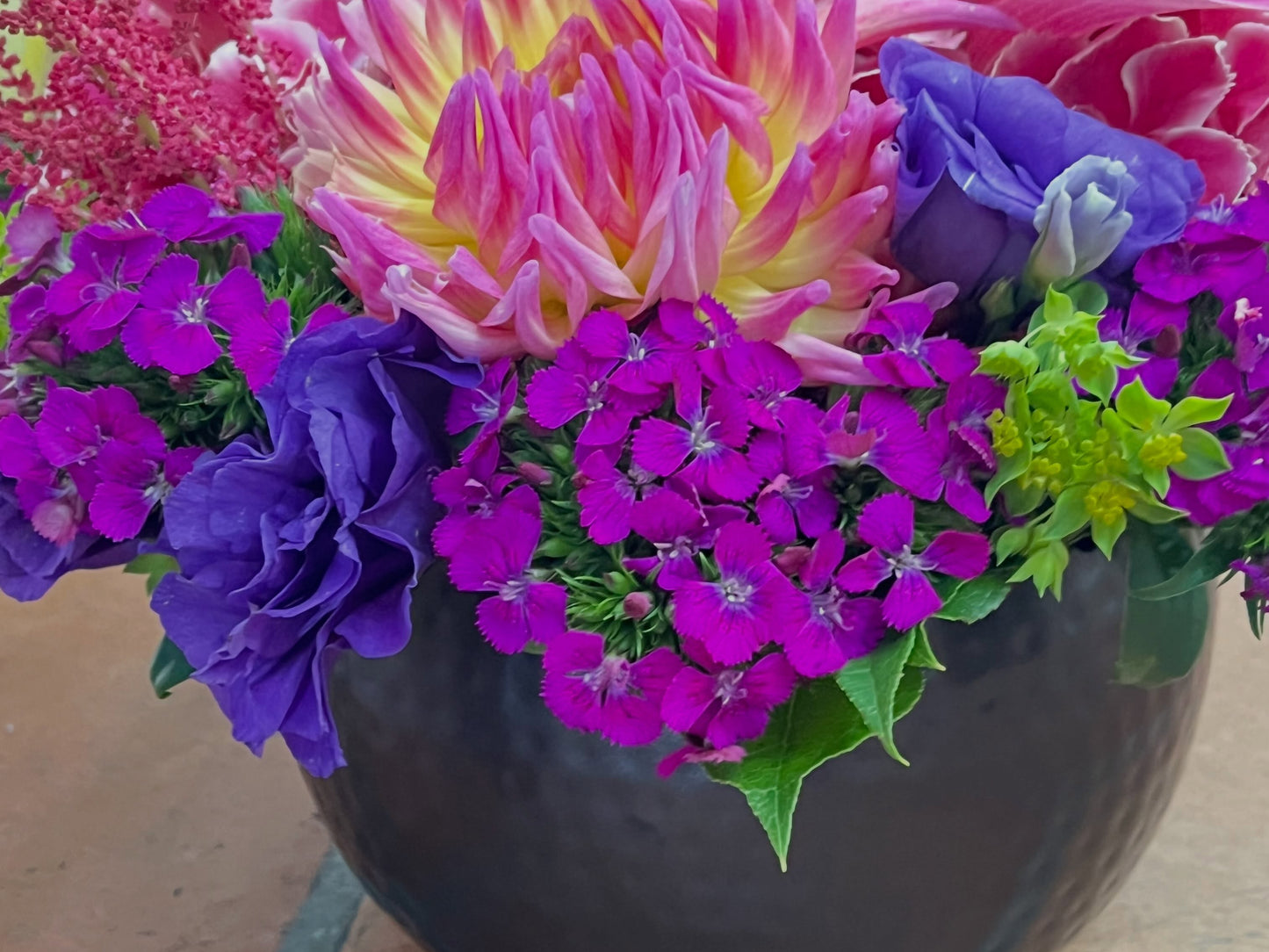 Fresh arrangement made by Jerome Florists in Manhattan, compared to a wire service stock photo