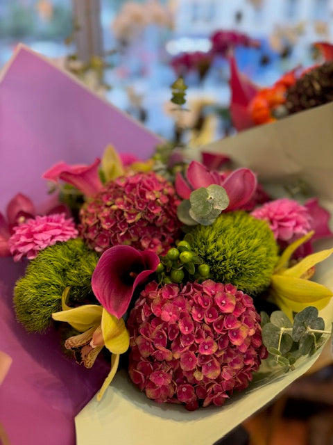 Hy Love small size: pink hydrangea, magenta callas, green dianthus and yellow cymbidium orchids in lavender wrap