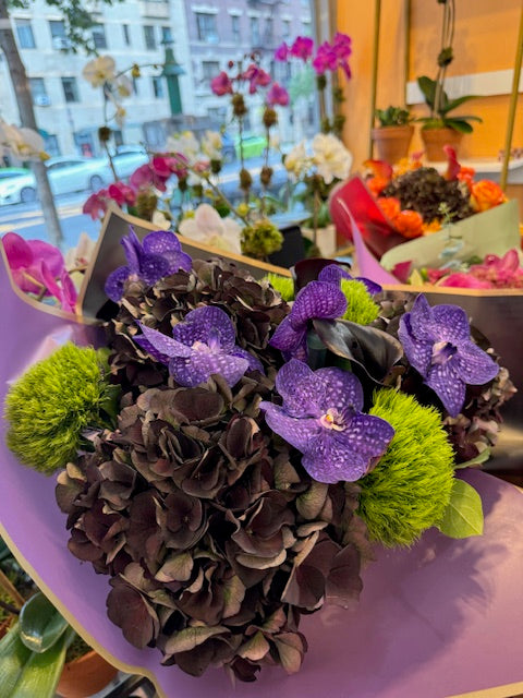 Dark Love, small size: antique hydrangea, purple vanda orchids and green dianthus wrapped in lavender paper, side view