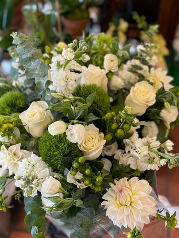 Erly Afternoon, medium with vase: white roses, white dahlia, stock, green dianthus, hypericum berries and eucalyptus