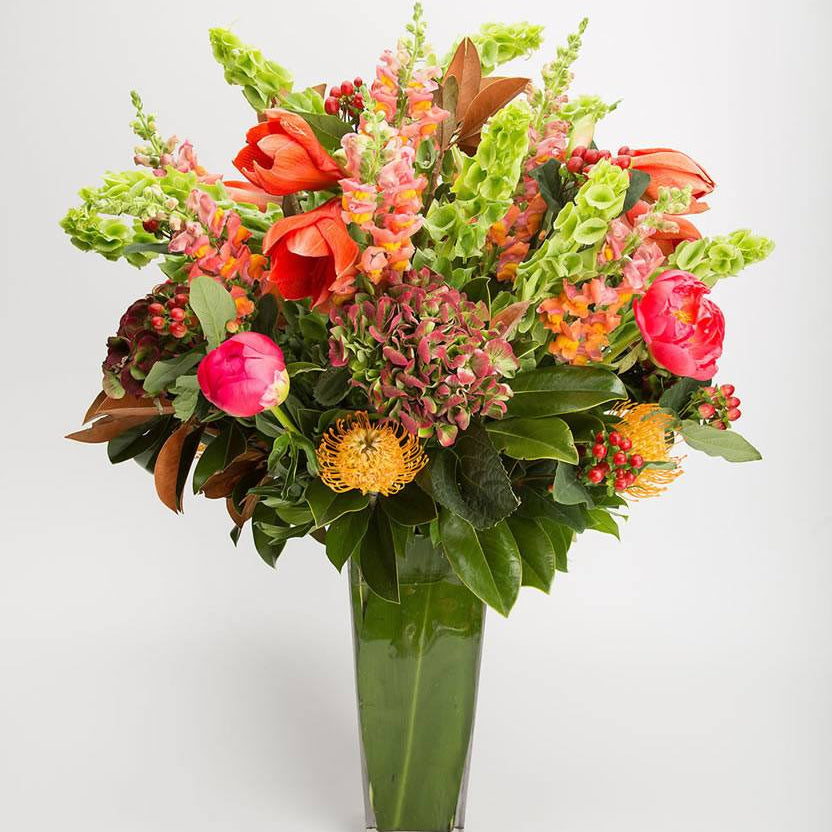 Tall floral arrangement with amaryllis, peonies, bells of Ireland, snaps, pincushions, and hydrangea – Jerome Florists NYC