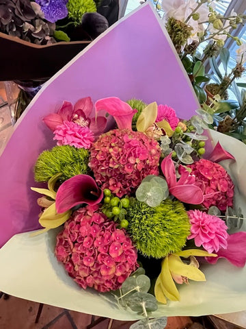 
                    
                      Hy Love bouquet of raspberry hydrangea, pink callas, cymbidium orchids, pink dahlias and green dianthus in lavender wrap
                    
                  
