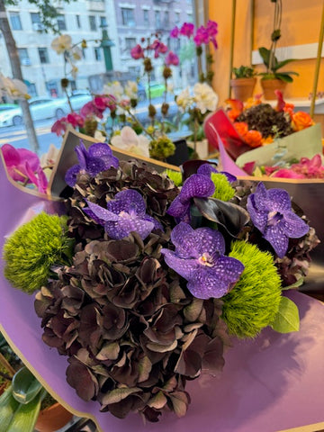 
                    
                      Dark Love, small size: antique hydrangea, purple vanda orchids and green dianthus wrapped in lavender paper, side view
                    
                  