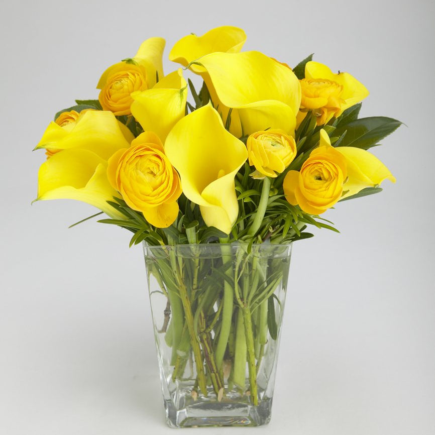 Bright yellow ranunculus and calla lily cheerful arrangement – Jerome Florists NYC
