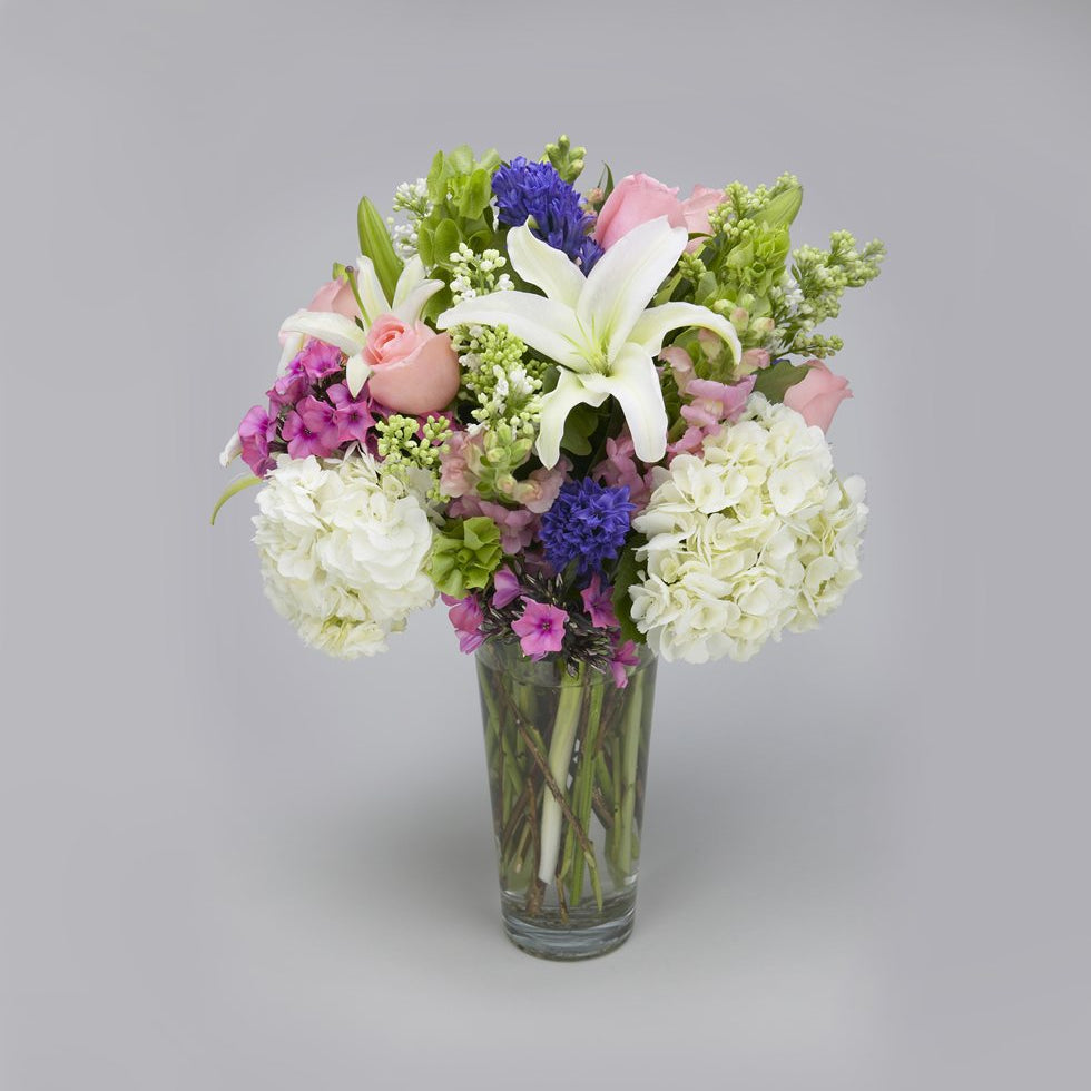 White hydrangea, pink roses, lilies, snaps and hyacinth pastel arrangement – Jerome Florists NYC
