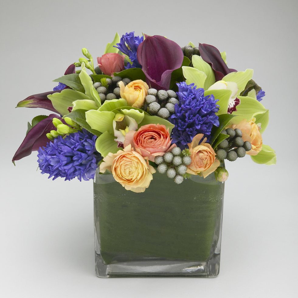 Purple calla lily and ranunculus stylish cube arrangement – Jerome Florists NYC